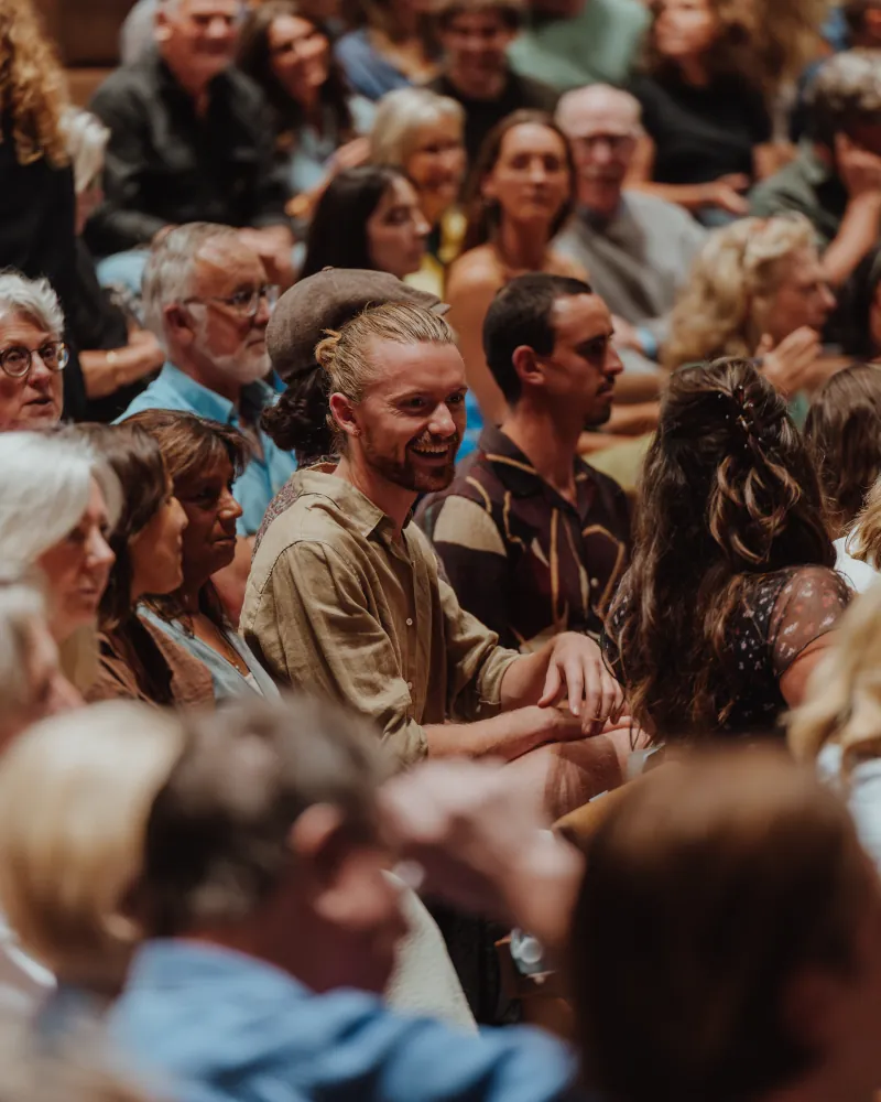 A full audience listening