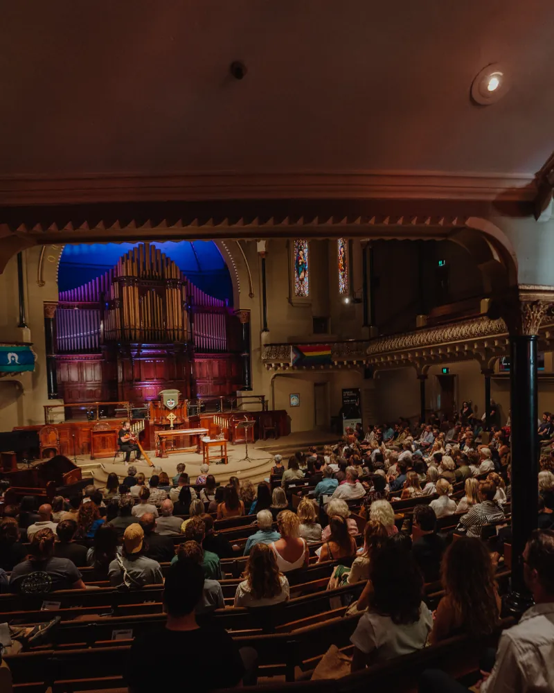 The audience seated for a talk