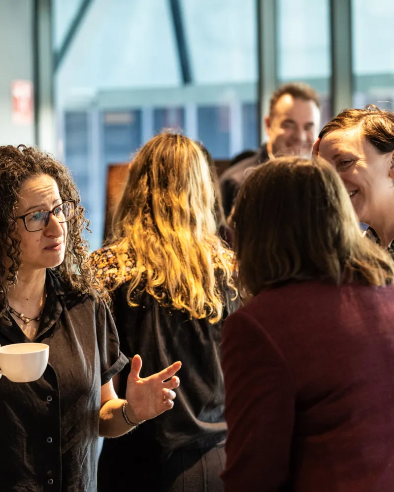 Guests in conversation at a daytime event